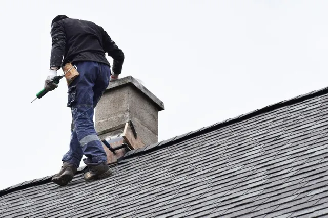 Chimney repair work in progress on a brick chimney